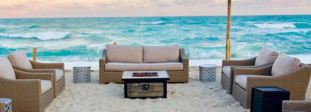 couches and firepit on the beach