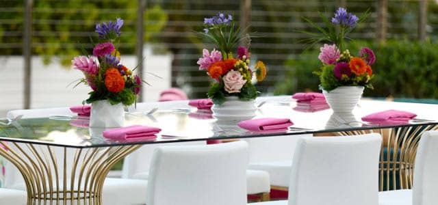 glass table top with flowers on top