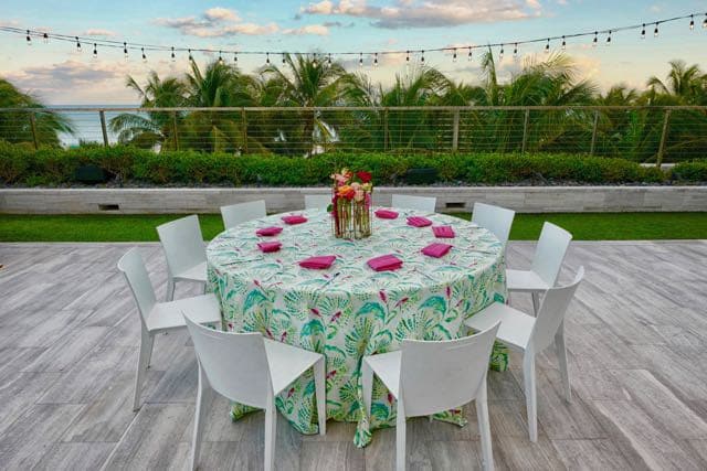 white chairs around white table on solid surface floors