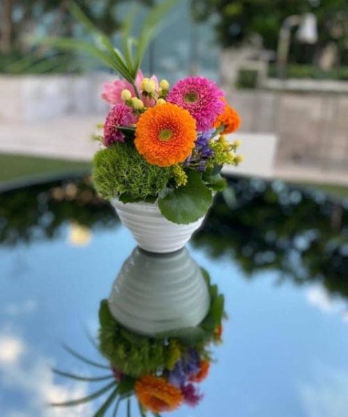 flower arrangement on glass table